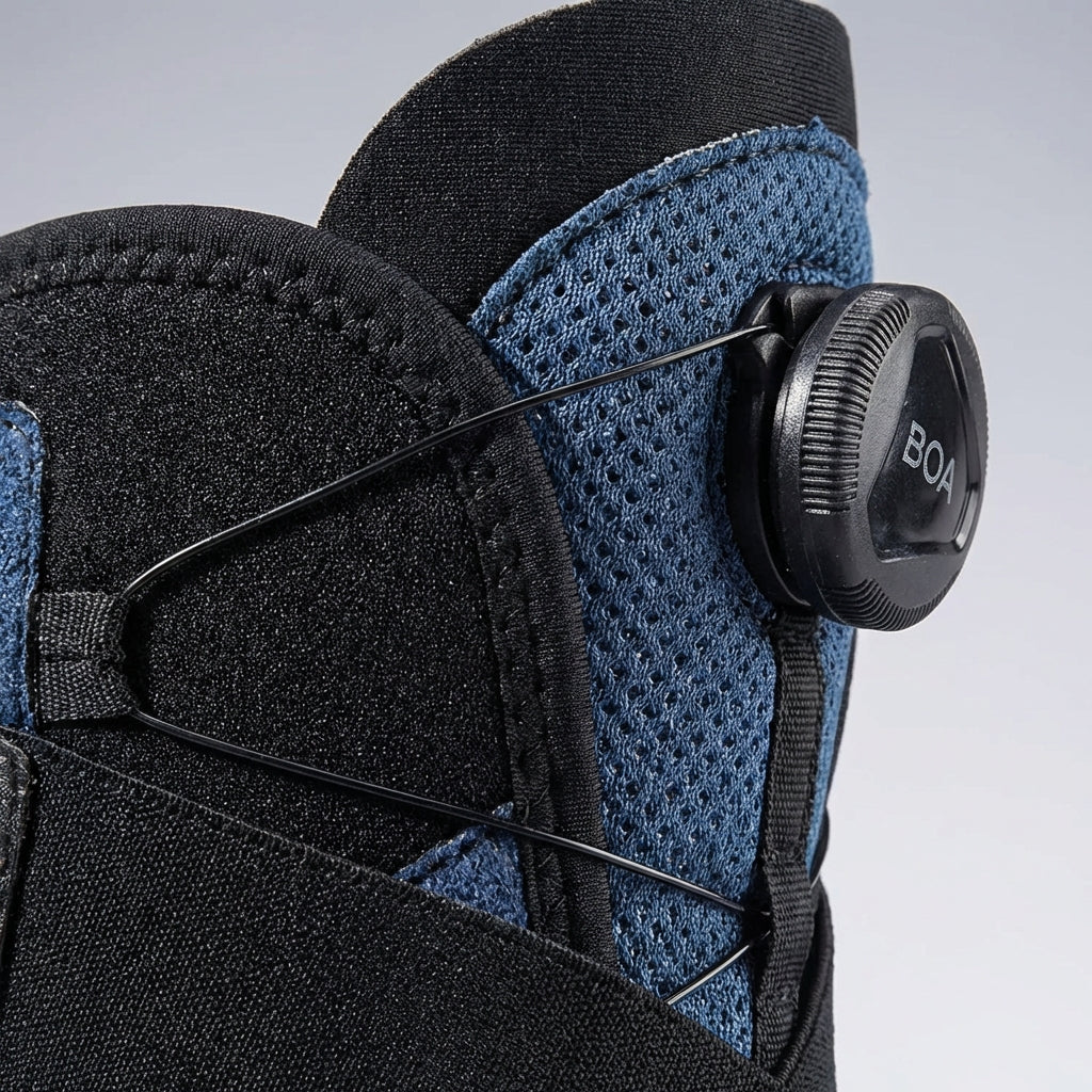 Adjustable ankle support with compression dial and lateral stabilizers