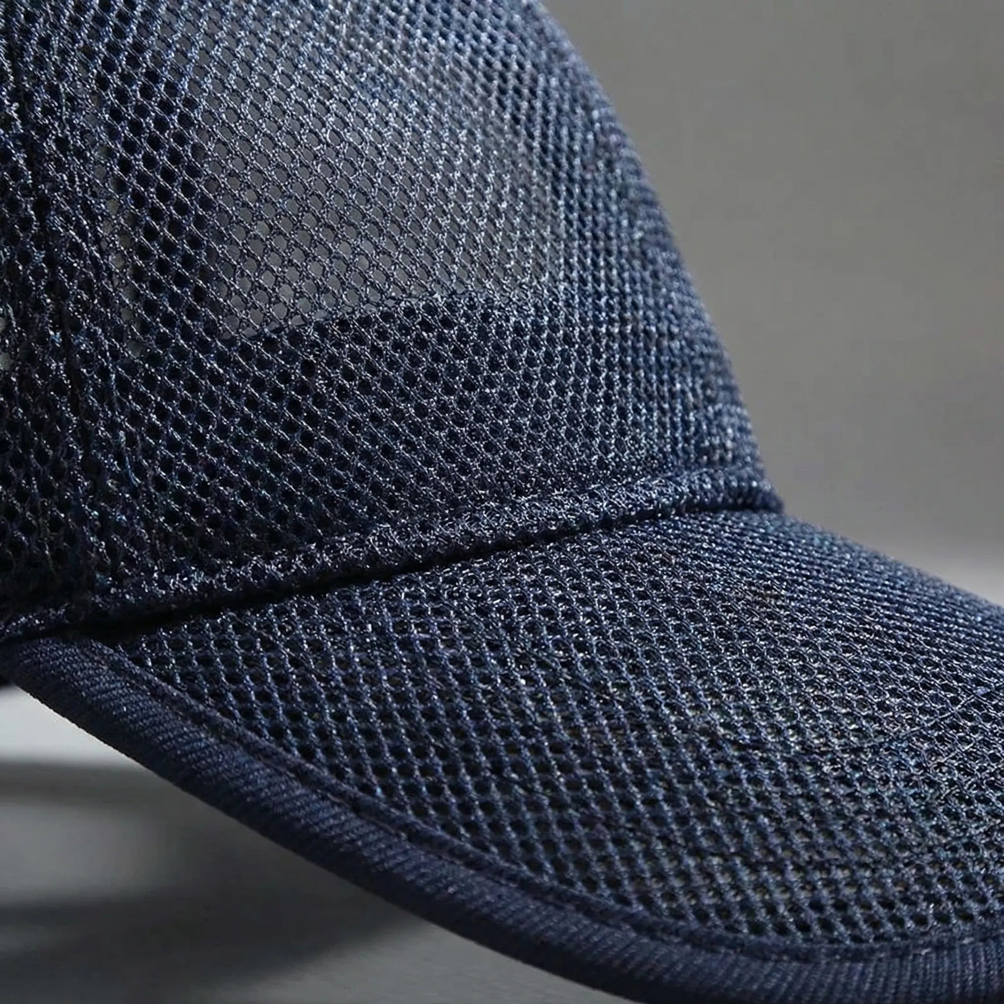 Full mesh baseball cap with open-weave construction and curved peak