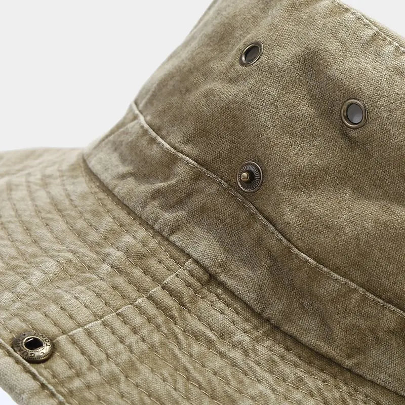 Wide brim outdoor fisherman hat with adjustable chin strap and ventilation