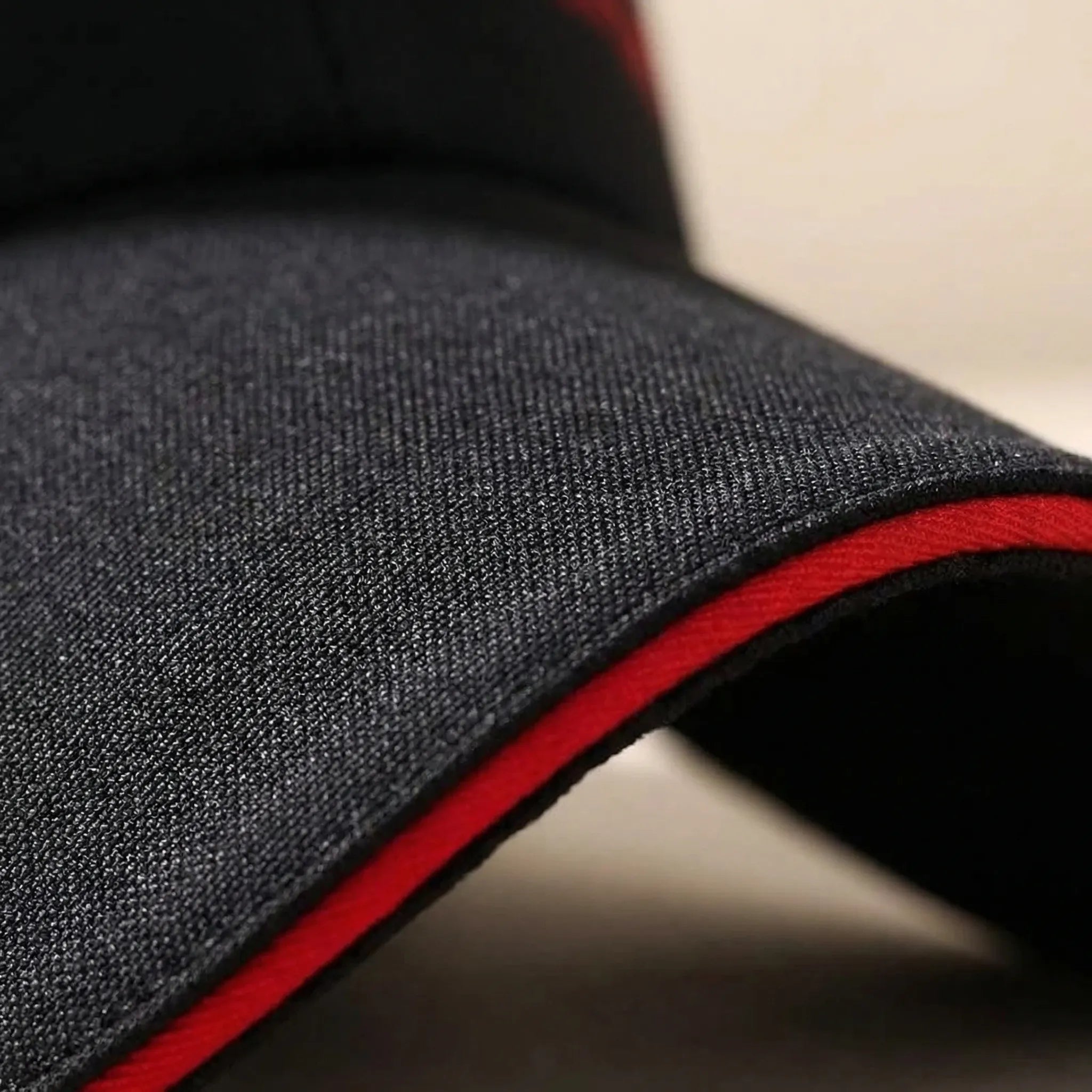Long brim baseball cap with adjustable fit and sporty graphic detailing
