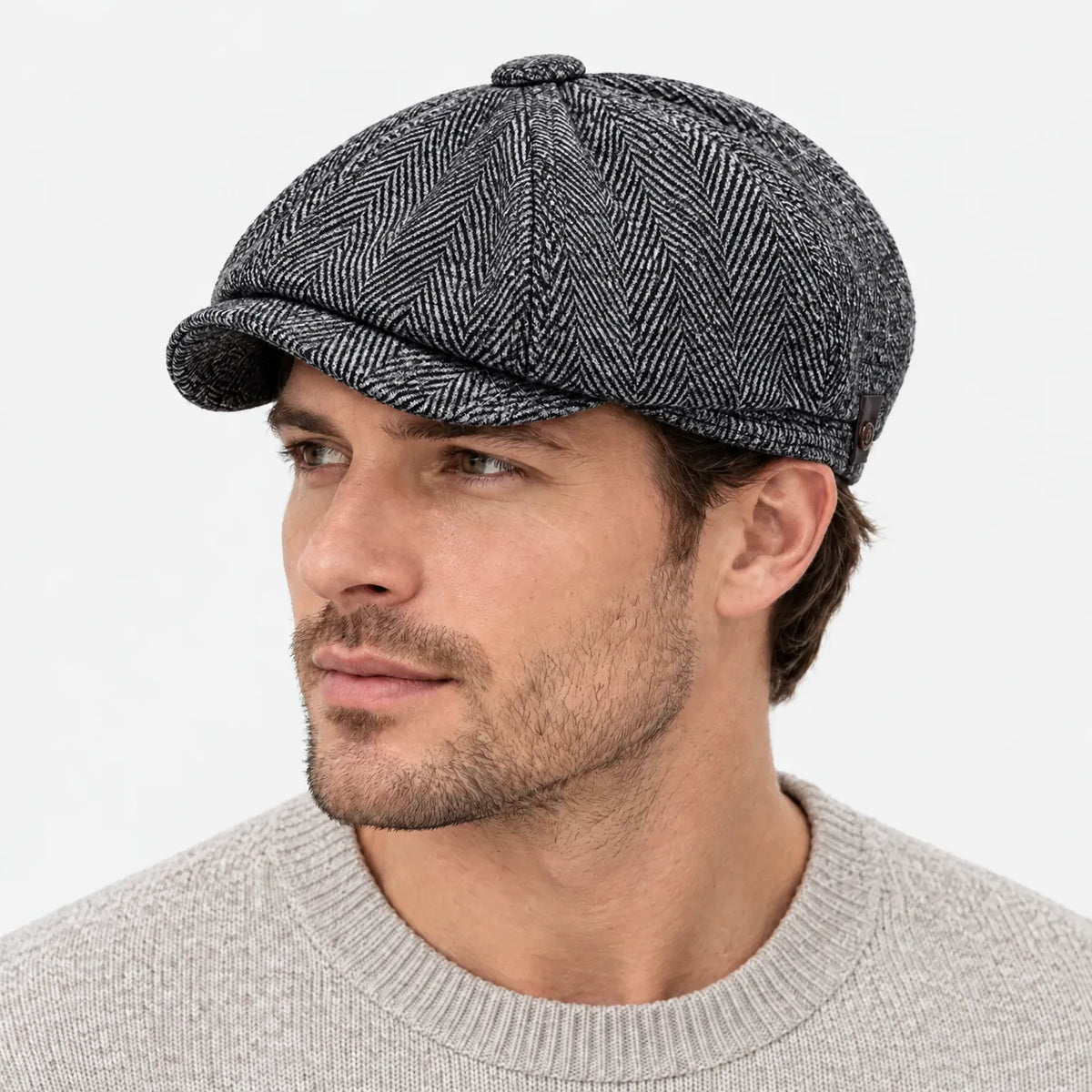 Eight-panel driver's cap with herringbone pattern and short bill