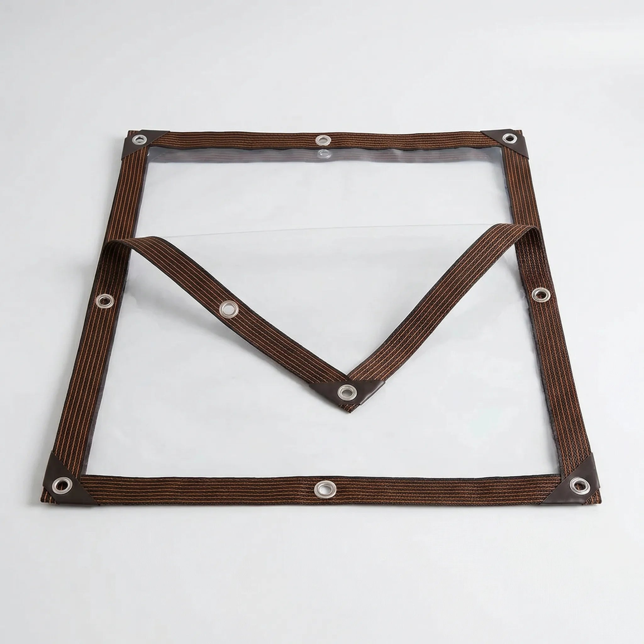 Transparent weather shield with clear light transmission and reinforced eyelets
