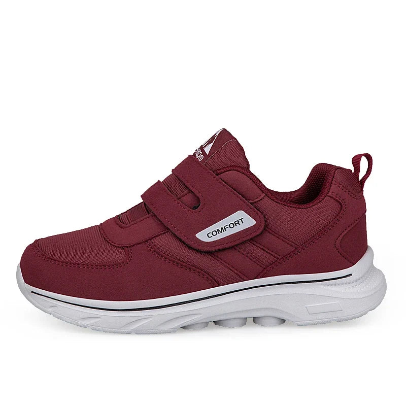 Orthopedic wide-fit walking sneaker with cushioned sole and hook-and-loop strap