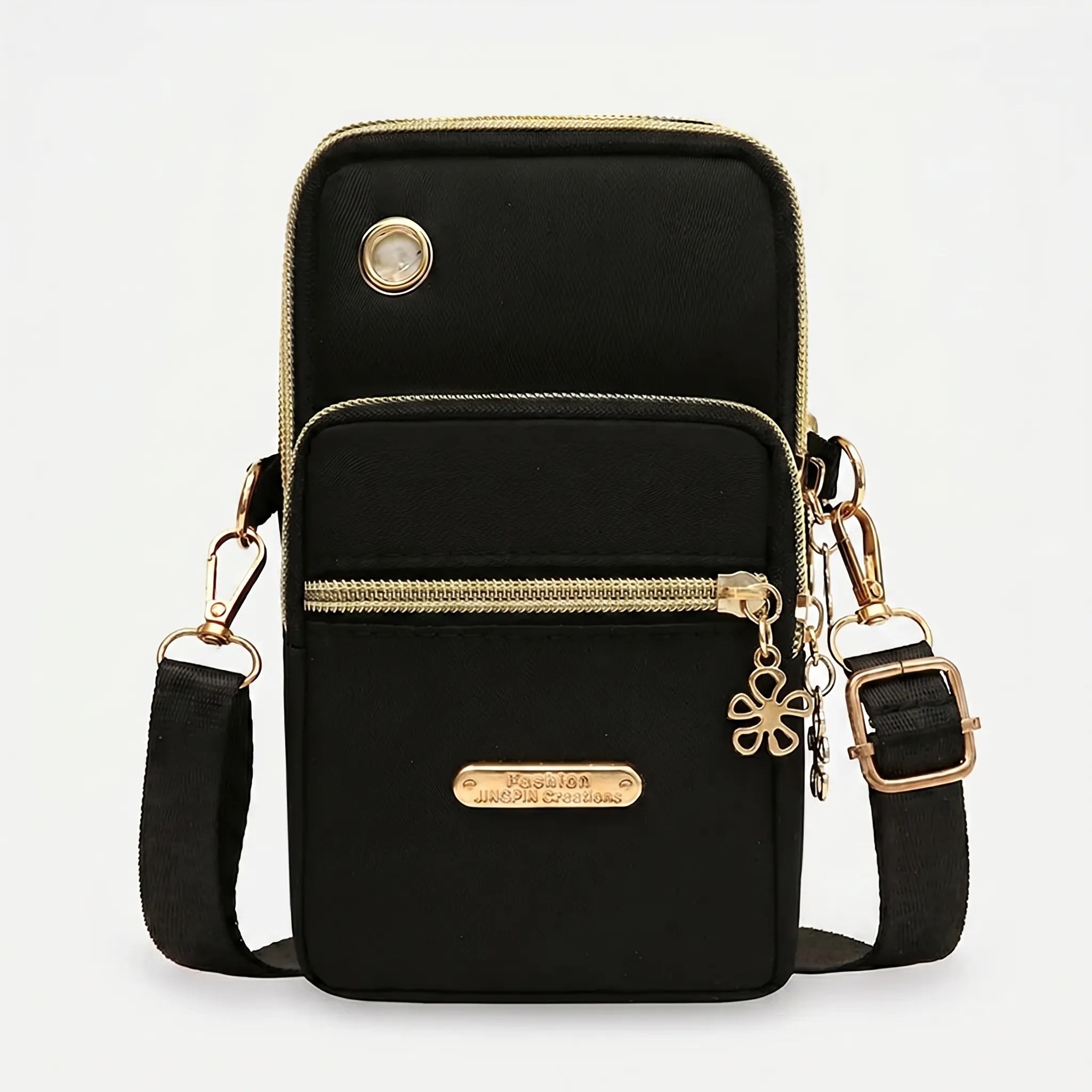 Compact crossbody bag with multiple zip pockets and adjustable strap