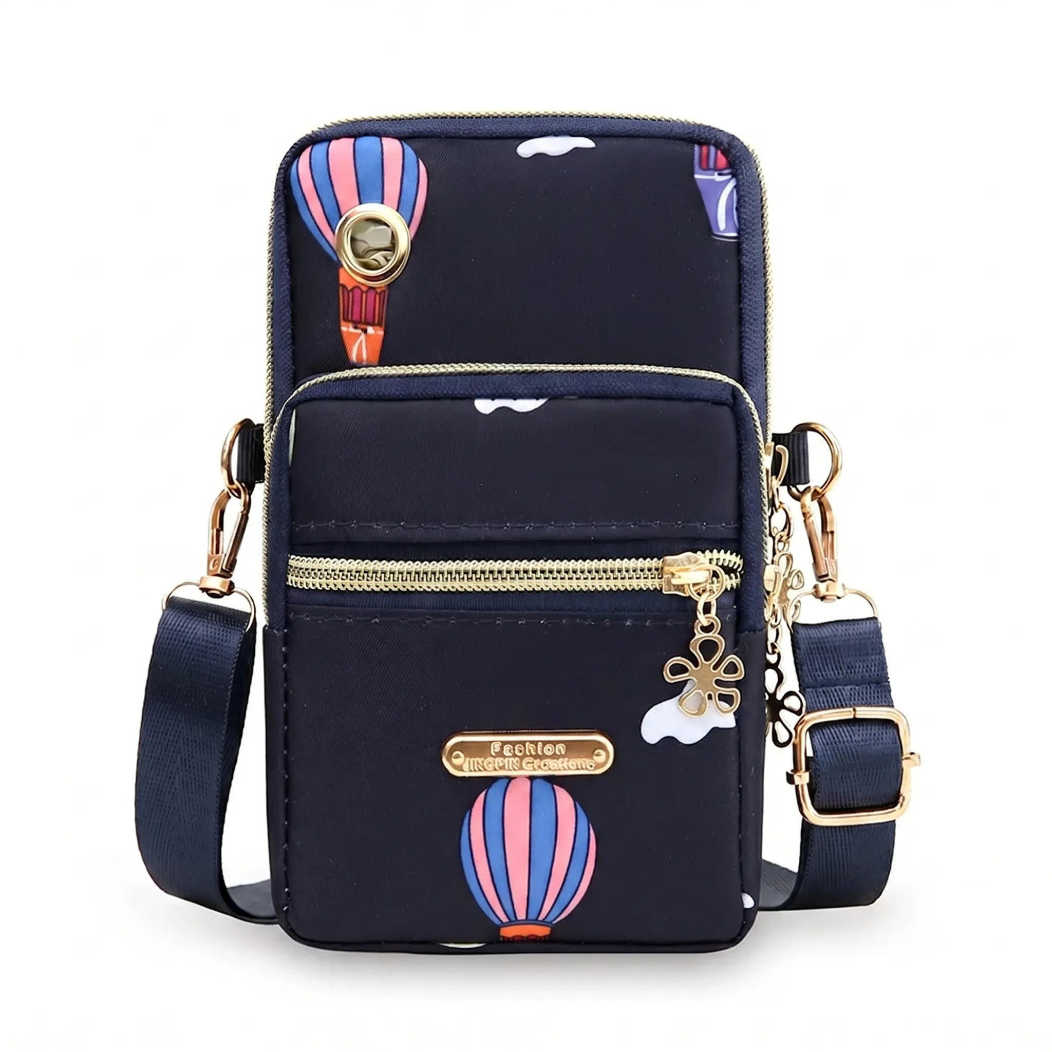 Compact crossbody bag with multiple zip pockets and adjustable strap