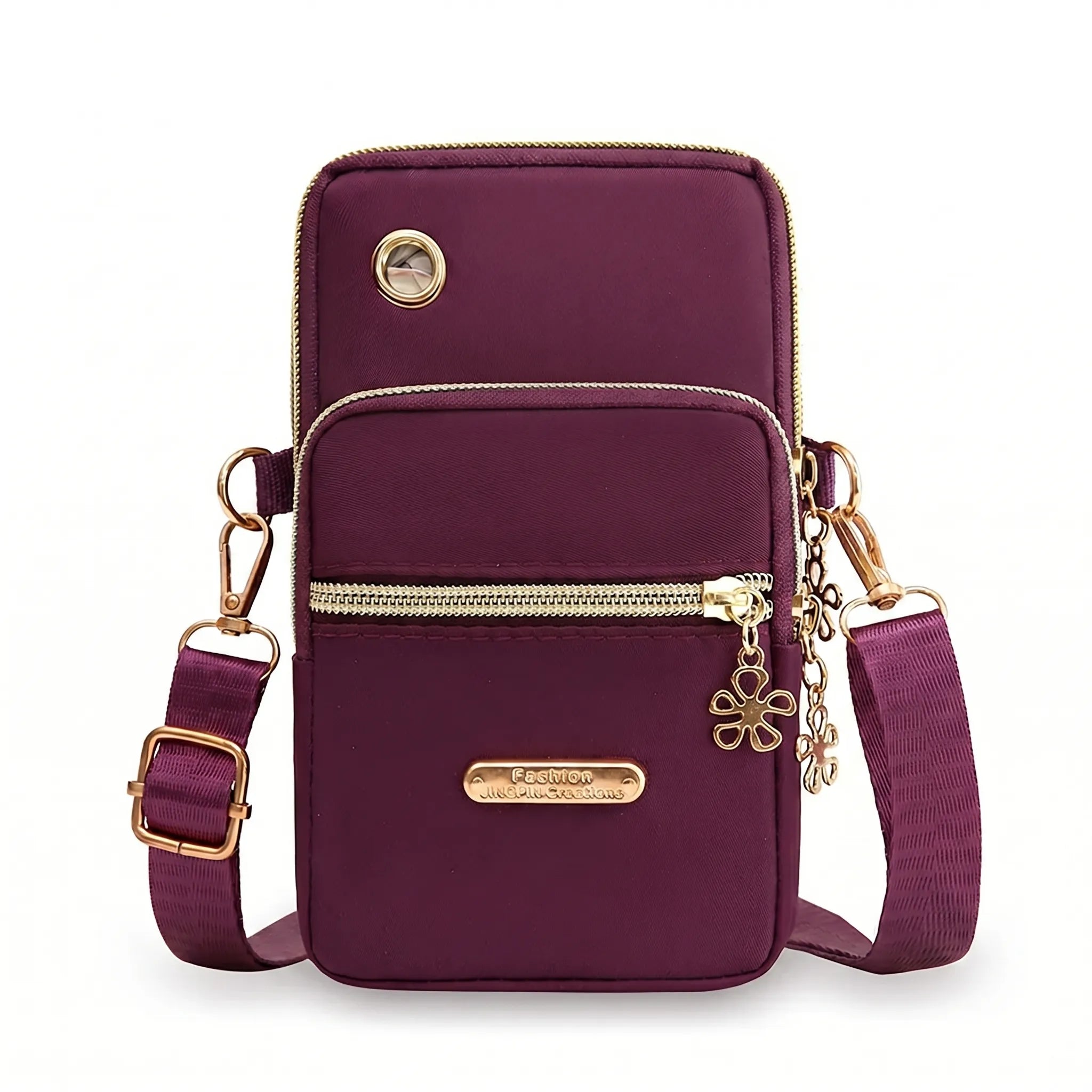 Compact crossbody bag with multiple zip pockets and adjustable strap