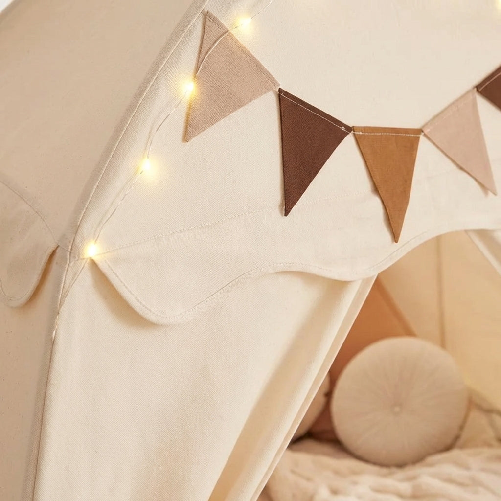Collapsible kids play tent with castle-style roof and pennant details