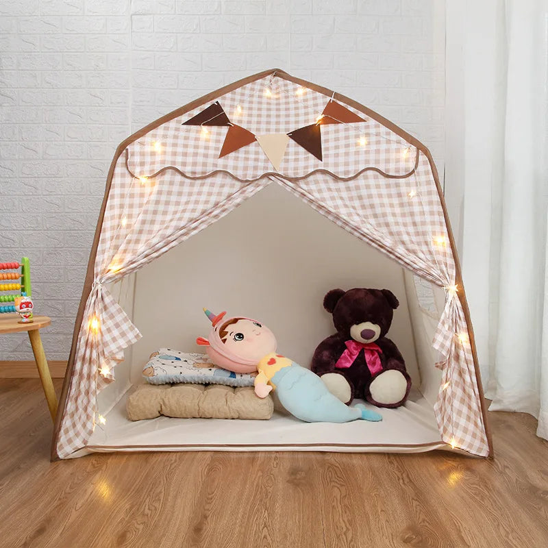 Collapsible kids play tent with castle-style roof and pennant details