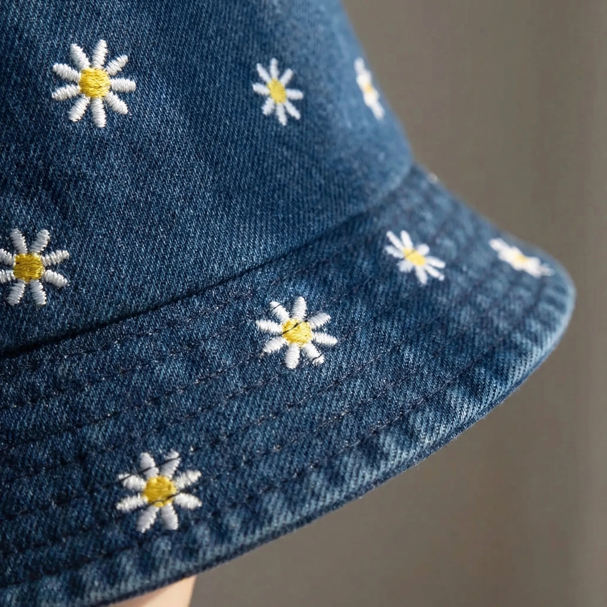 Daisy embroidered bucket hat with wide brim and washed denim finish