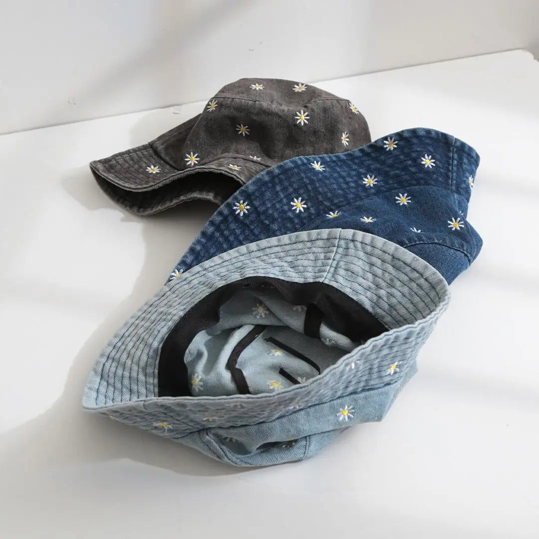 Daisy embroidered bucket hat with wide brim and washed denim finish