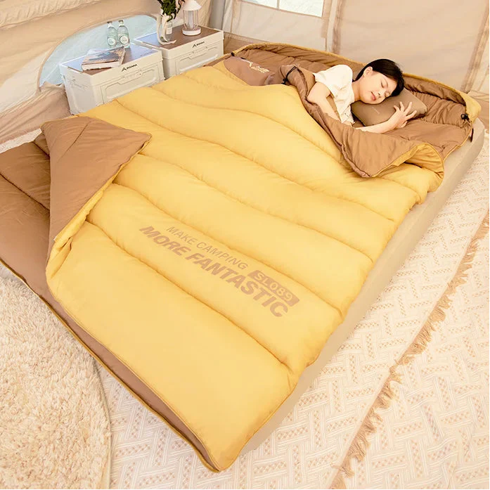 Two-person camping sleeping bag with double envelope design
