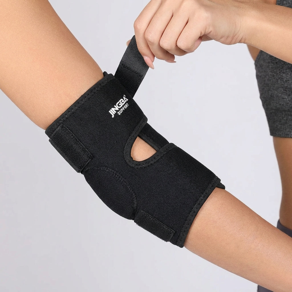 Adjustable elbow compression brace with targeted support and breathable design