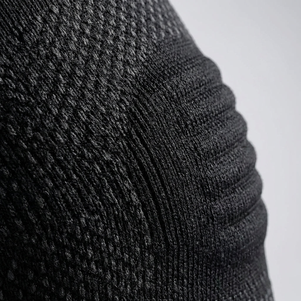 Breathable compression elbow sleeve with graduated support and low-profile fit