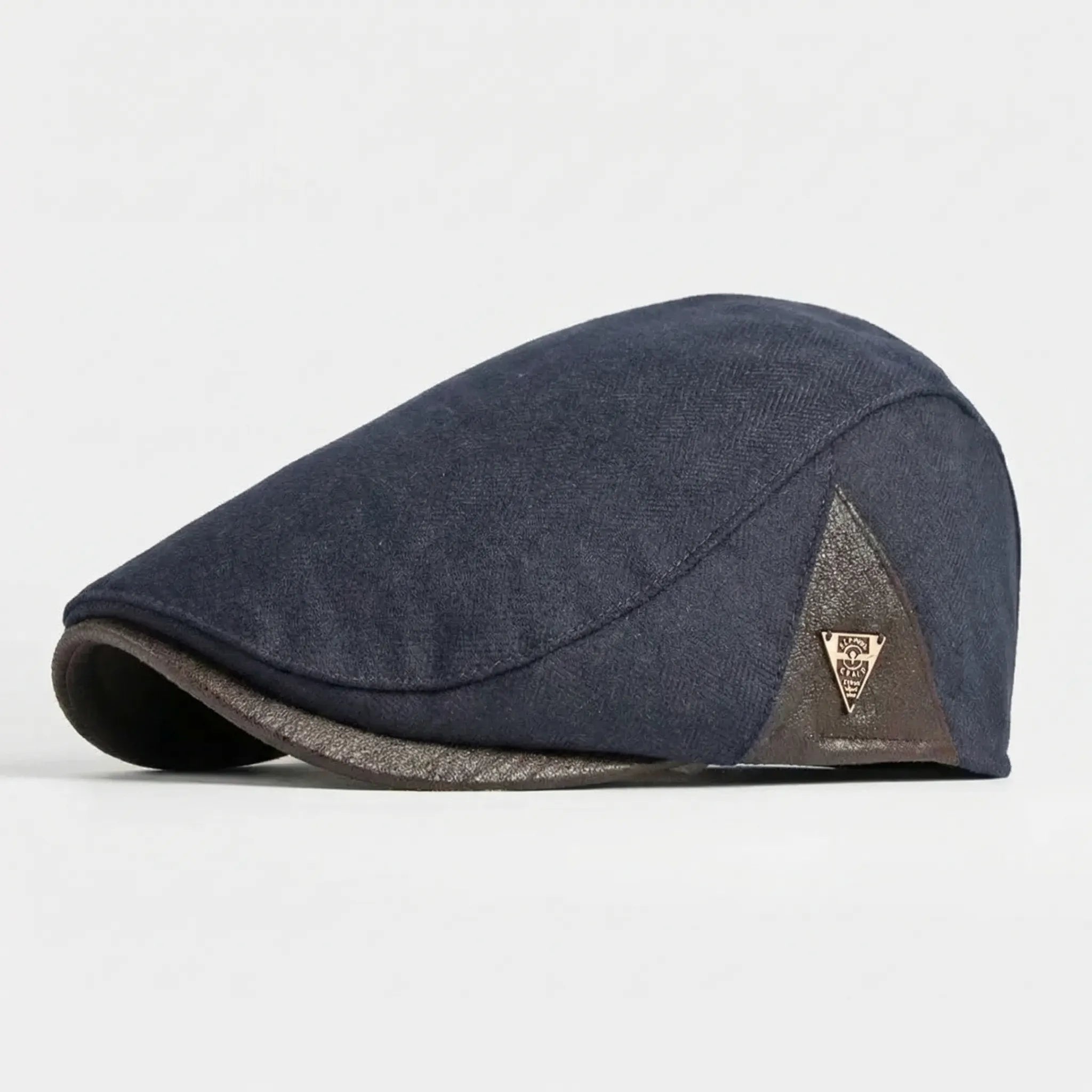 Men's classic flat cap with herringbone weave and metal badge detail