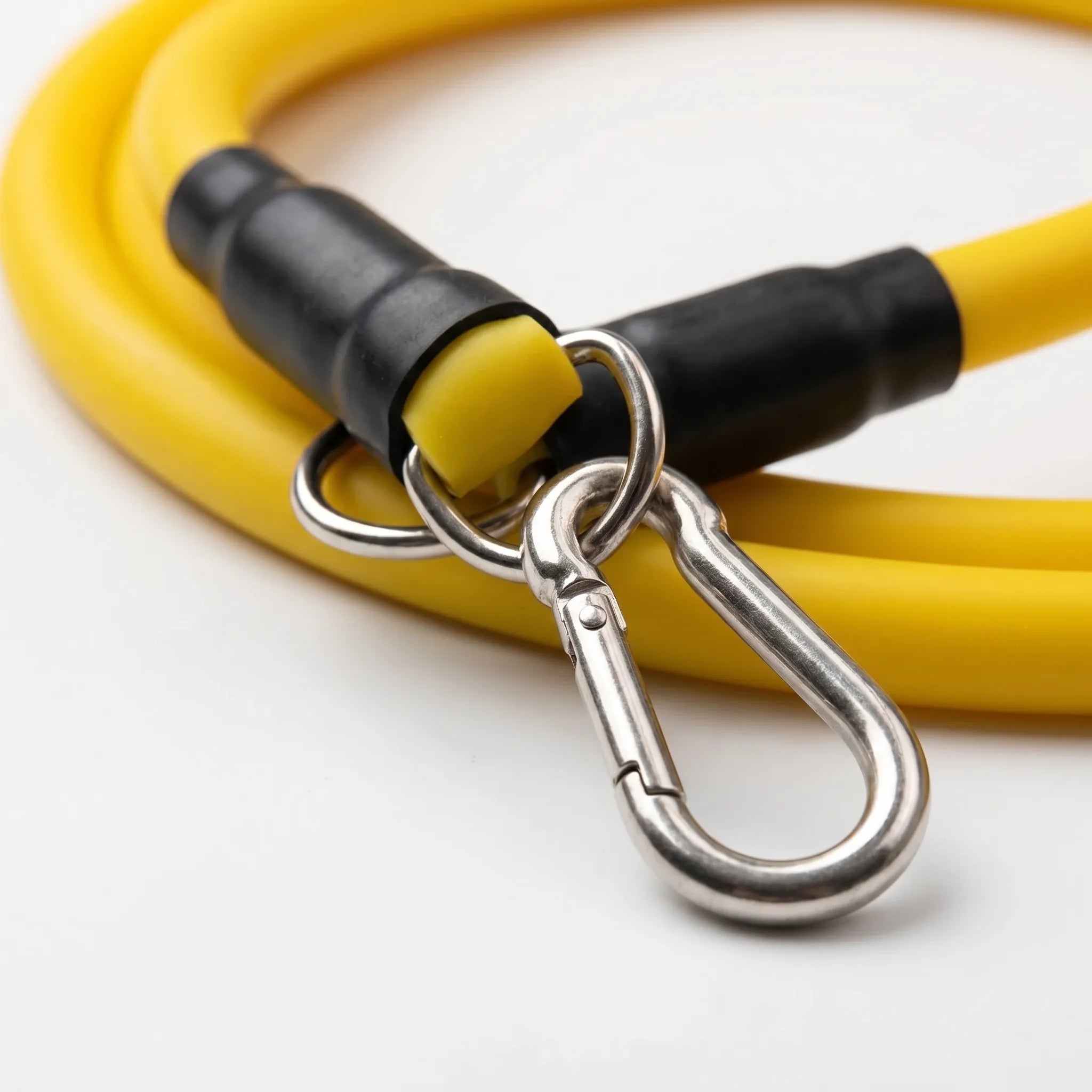 Tubular resistance band set with color-coded tubes and metal carabiner clips