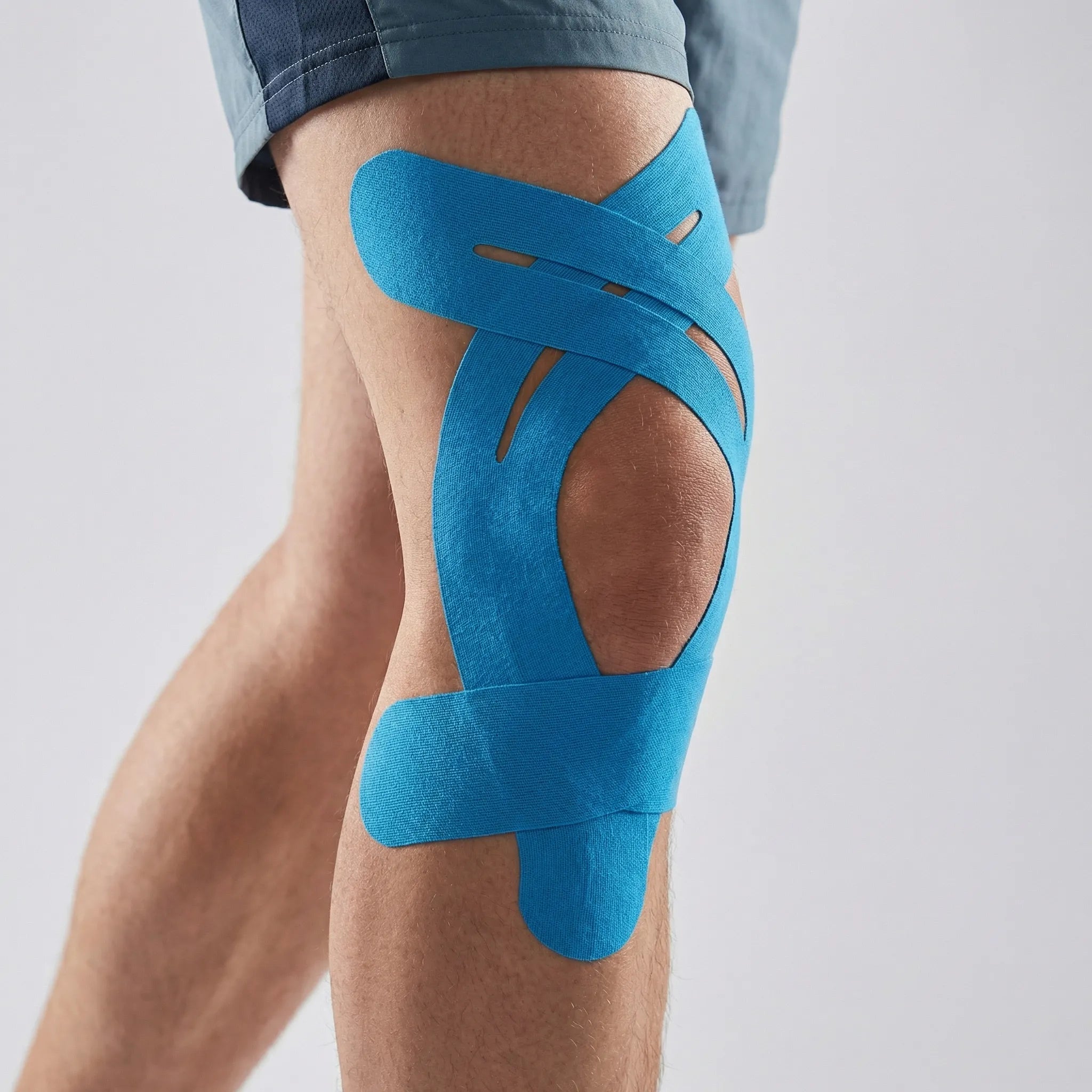 Elastic kinesiology knee tape with breathable fabric and water-resistant strips