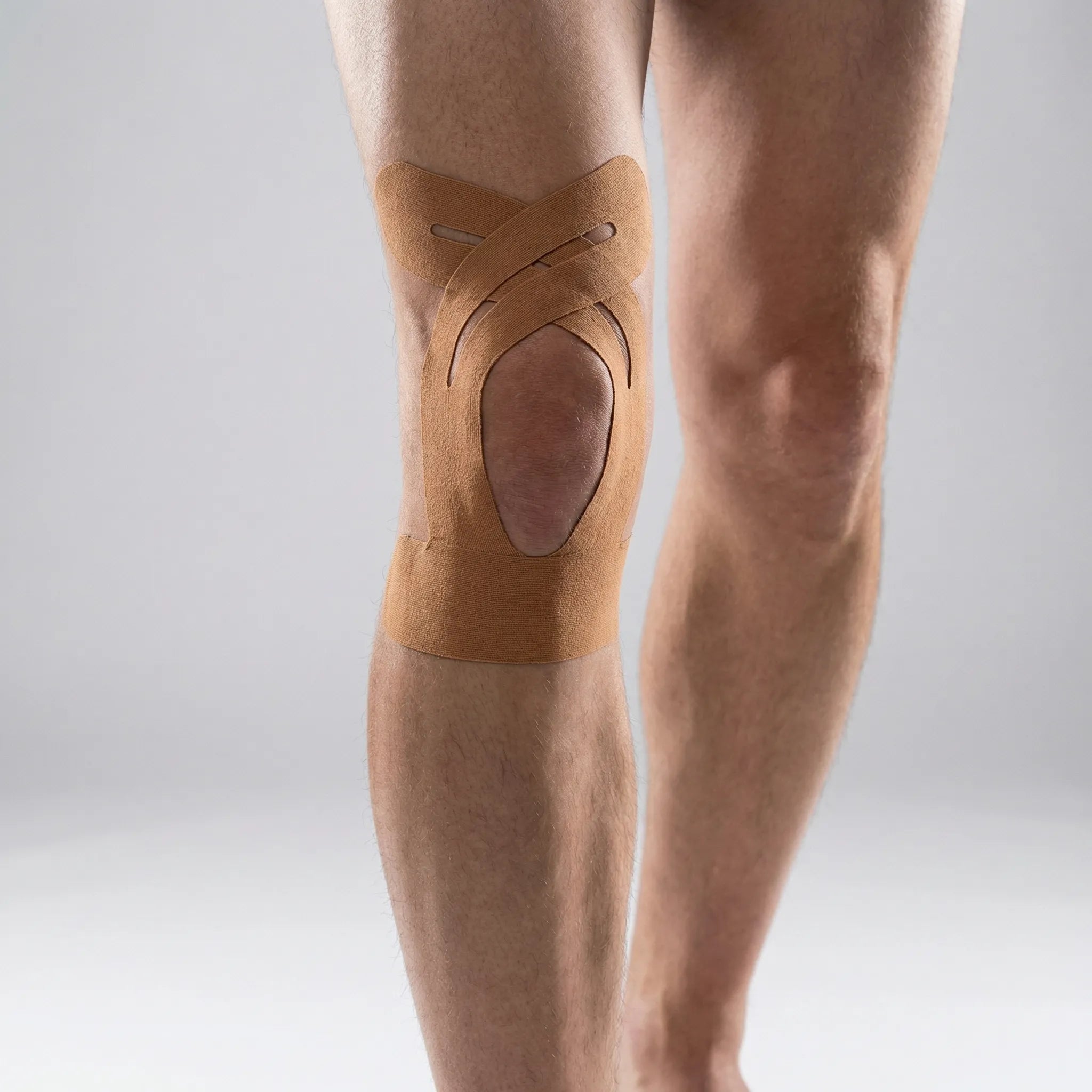 Elastic kinesiology knee tape with breathable fabric and water-resistant strips