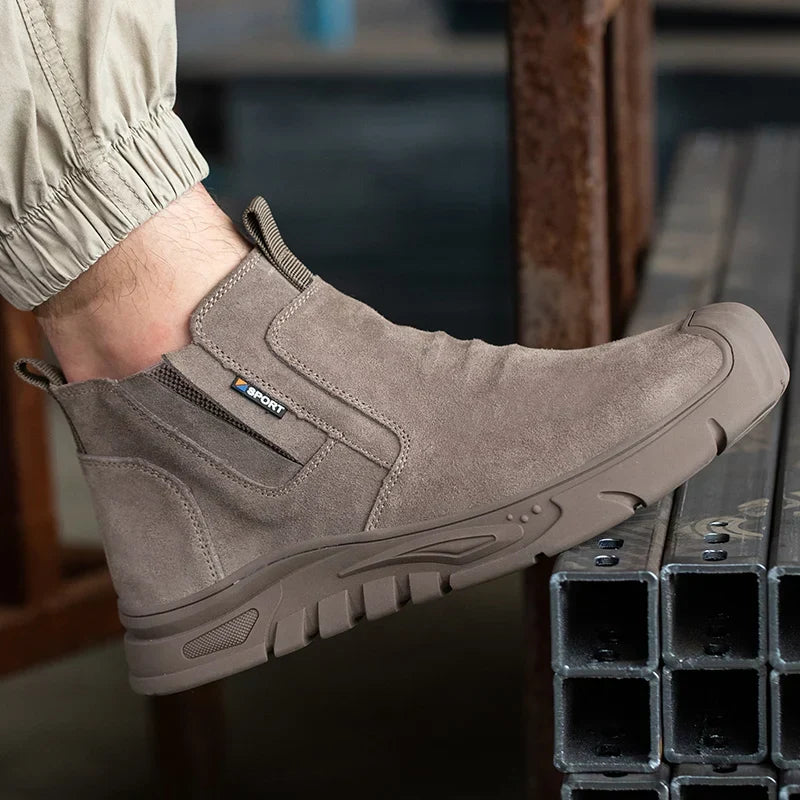 Slip-on safety boot with reinforced toe protection and puncture-resistant sole