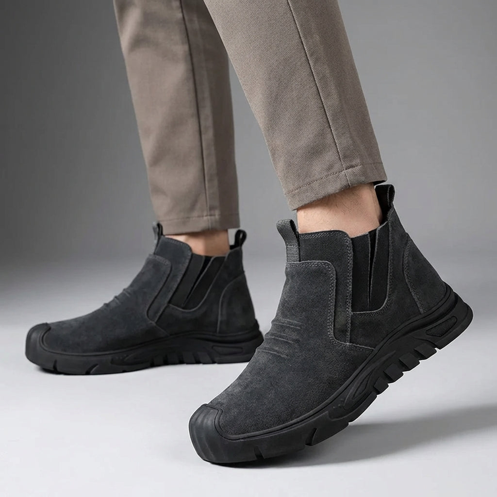 Slip-on safety boot with reinforced toe protection and puncture-resistant sole