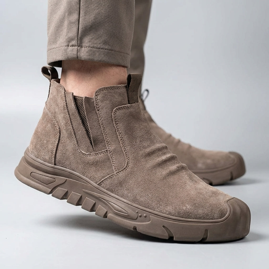 Slip-on safety boot with reinforced toe protection and puncture-resistant sole