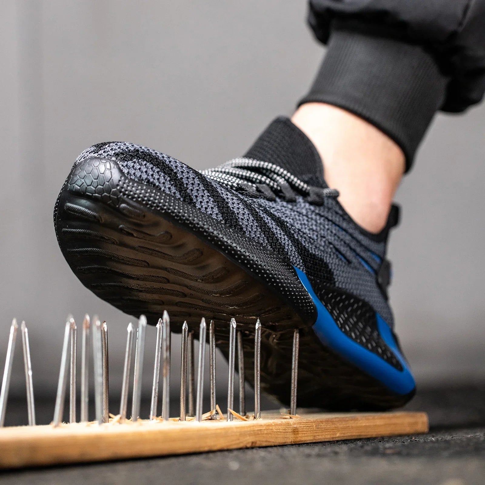 Low profile safety sneakers with reinforced toe protection and breathable upper