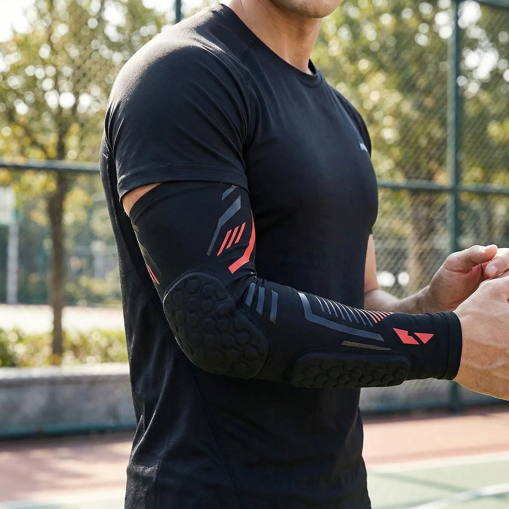 Padded compression arm sleeve with honeycomb elbow protection
