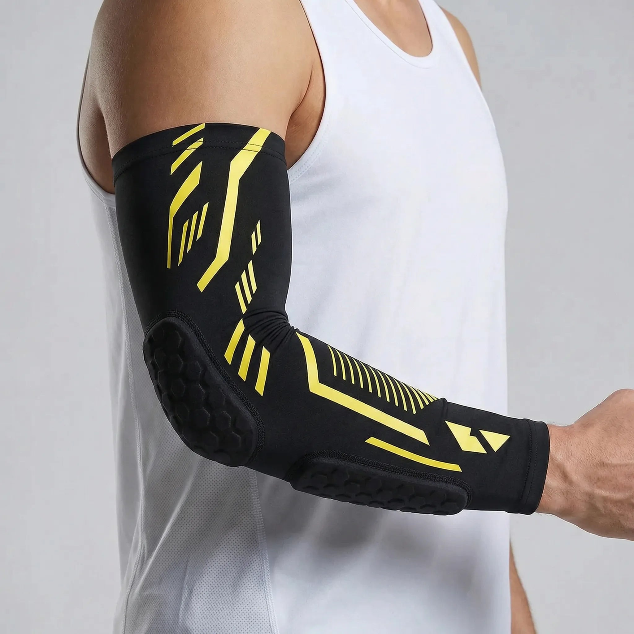 Padded compression arm sleeve with honeycomb elbow protection
