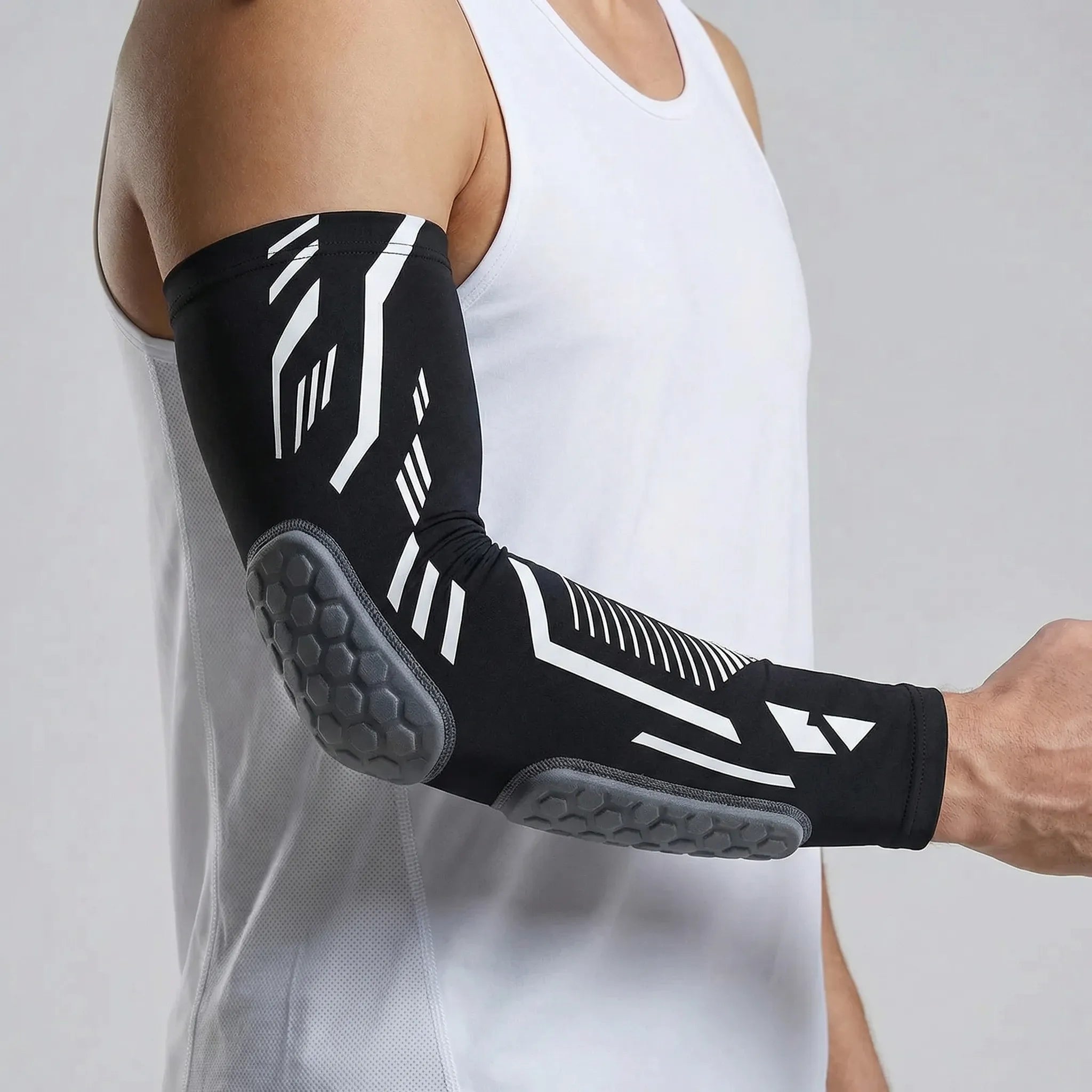 Padded compression arm sleeve with honeycomb elbow protection