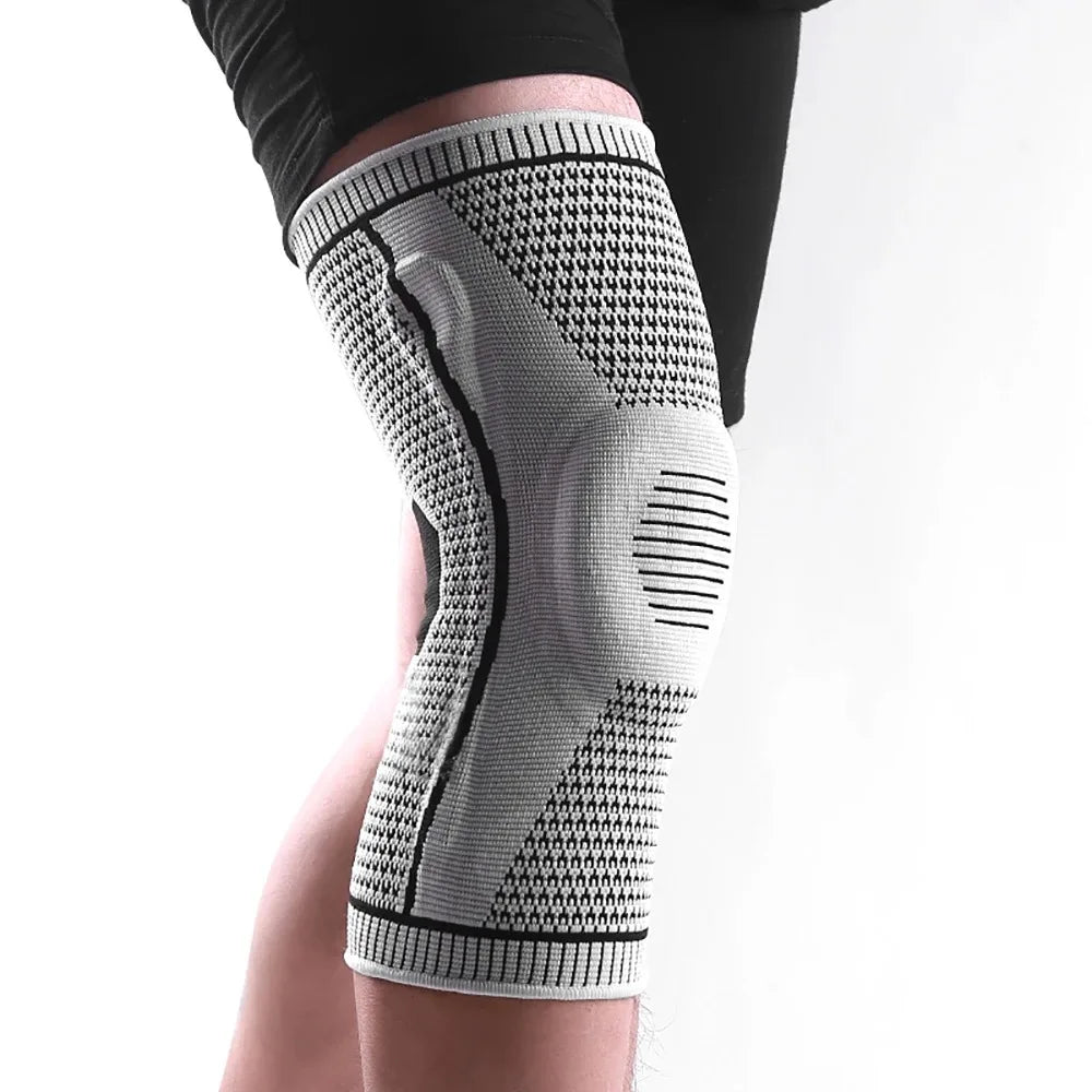 Breathable knee compression sleeve with silicone support pad