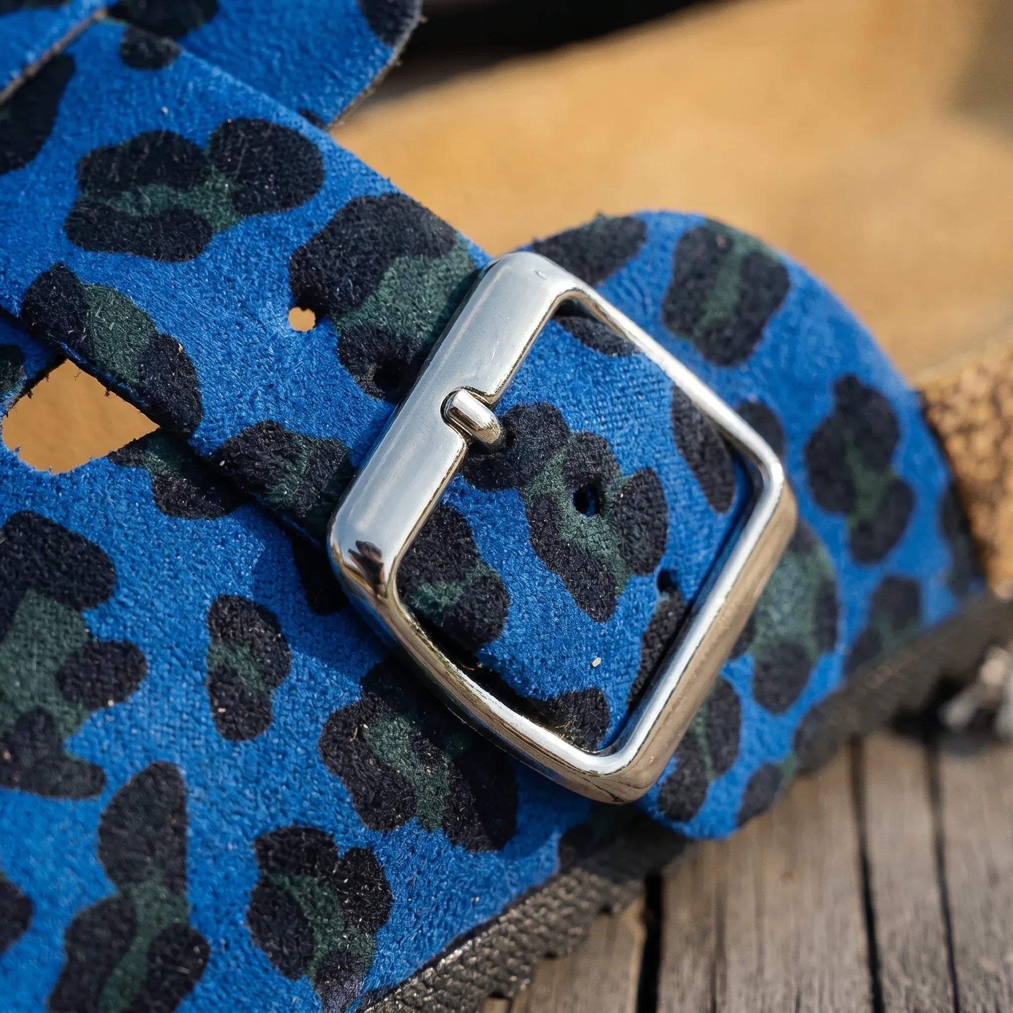 Women's leopard print slides with adjustable strap and flat sole