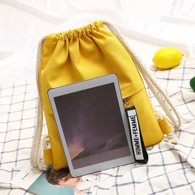 Lightweight drawstring backpack with soft canvas exterior and rope shoulder straps