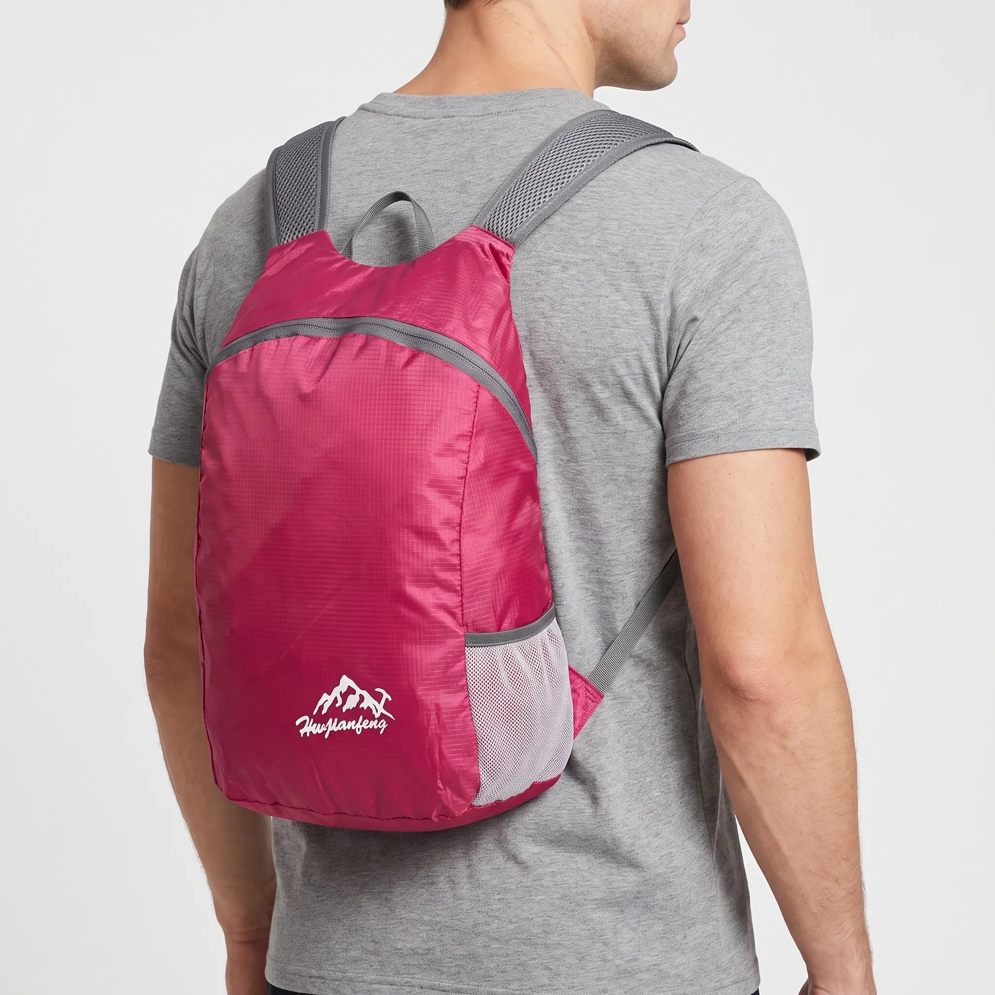 Foldable lightweight daypack with water-repellent outer shell and ventilated mesh straps