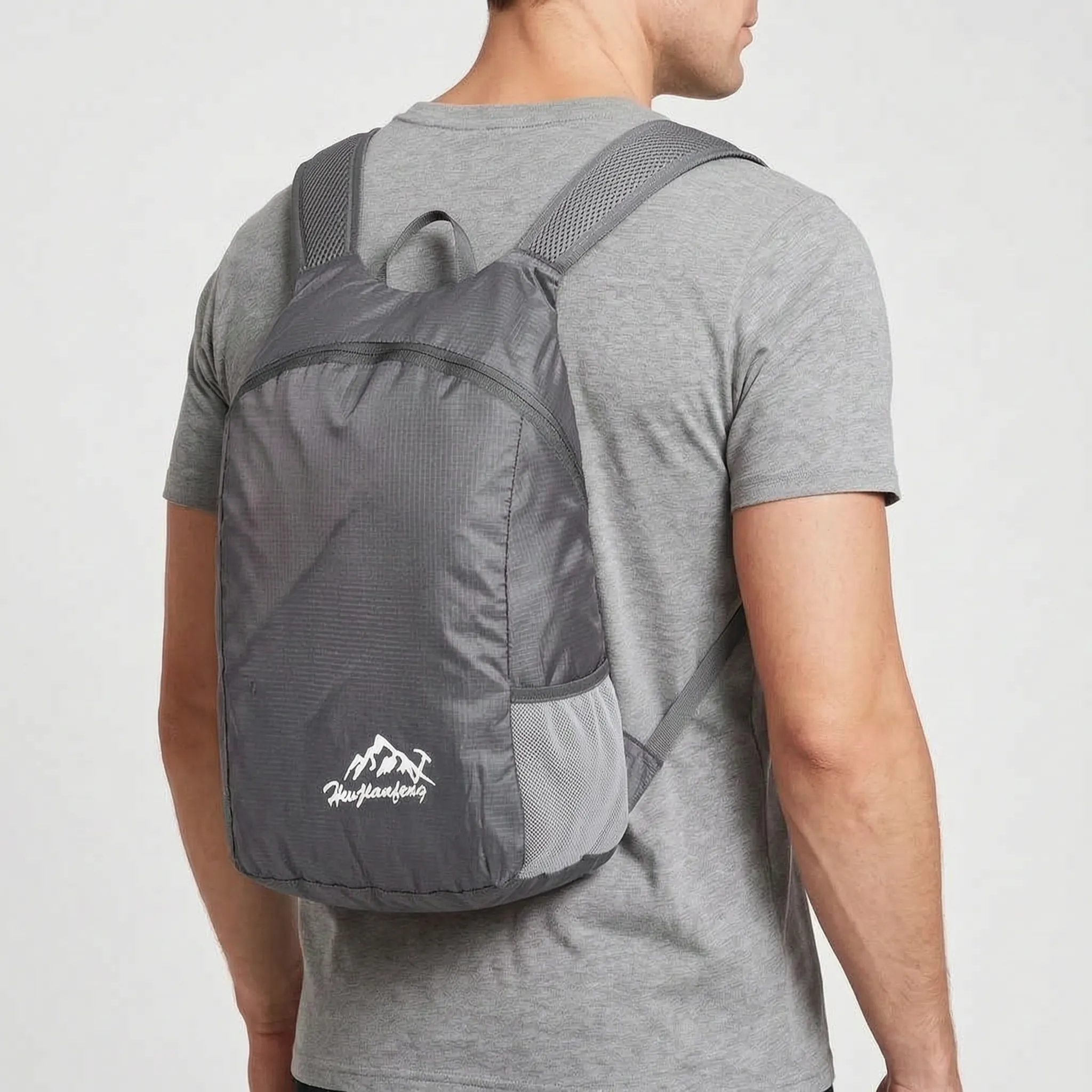 Foldable lightweight daypack with water-repellent outer shell and ventilated mesh straps