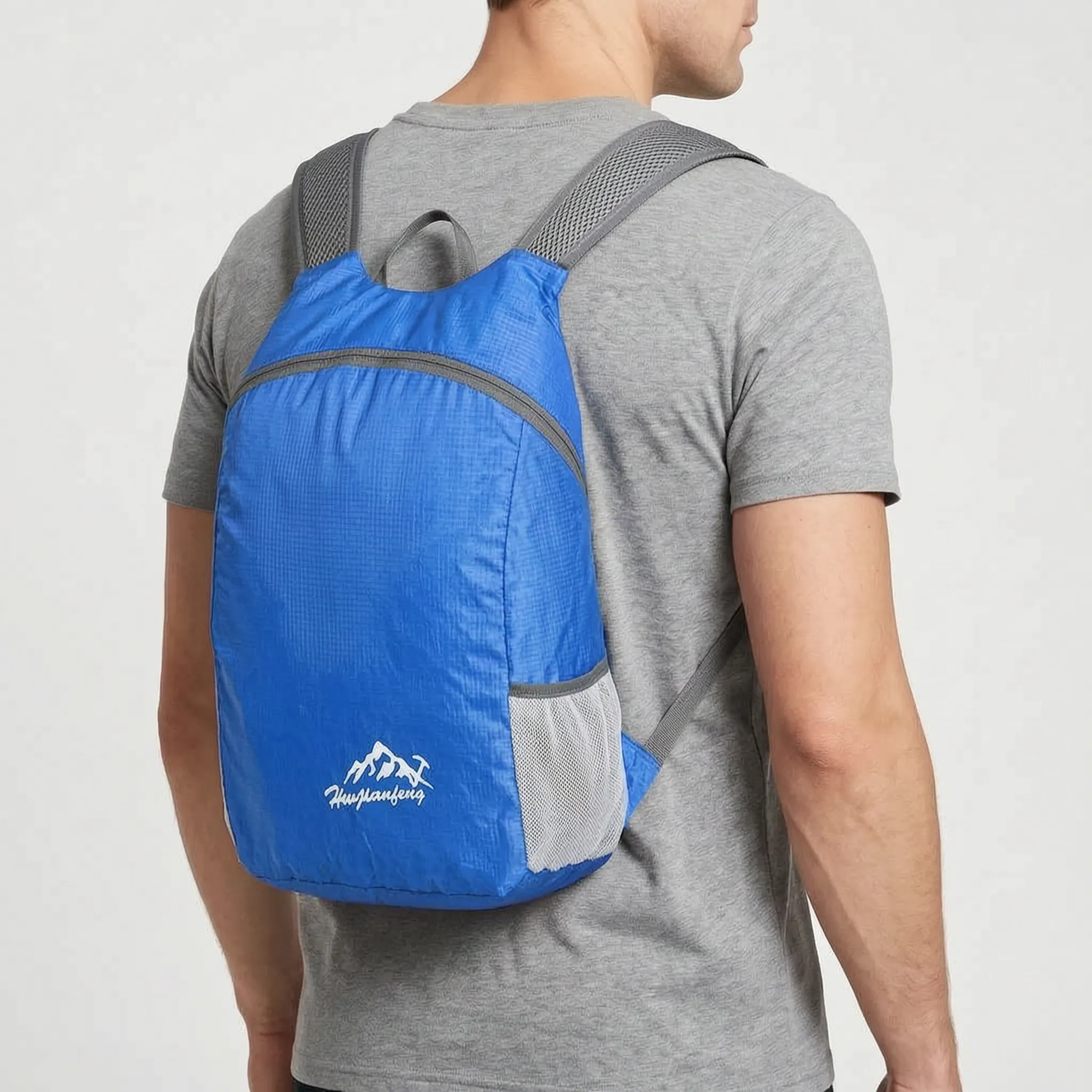Foldable lightweight daypack with water-repellent outer shell and ventilated mesh straps
