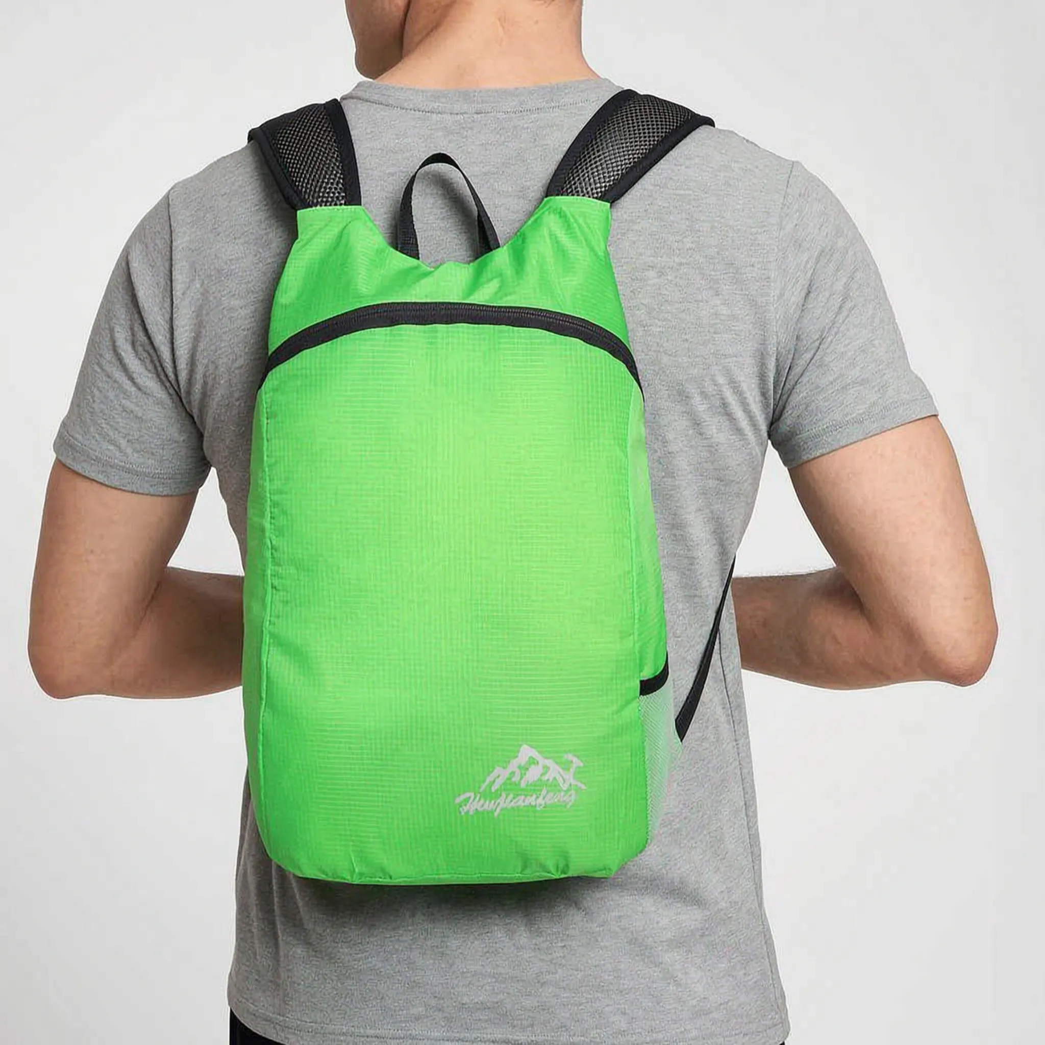 Foldable lightweight daypack with water-repellent outer shell and ventilated mesh straps