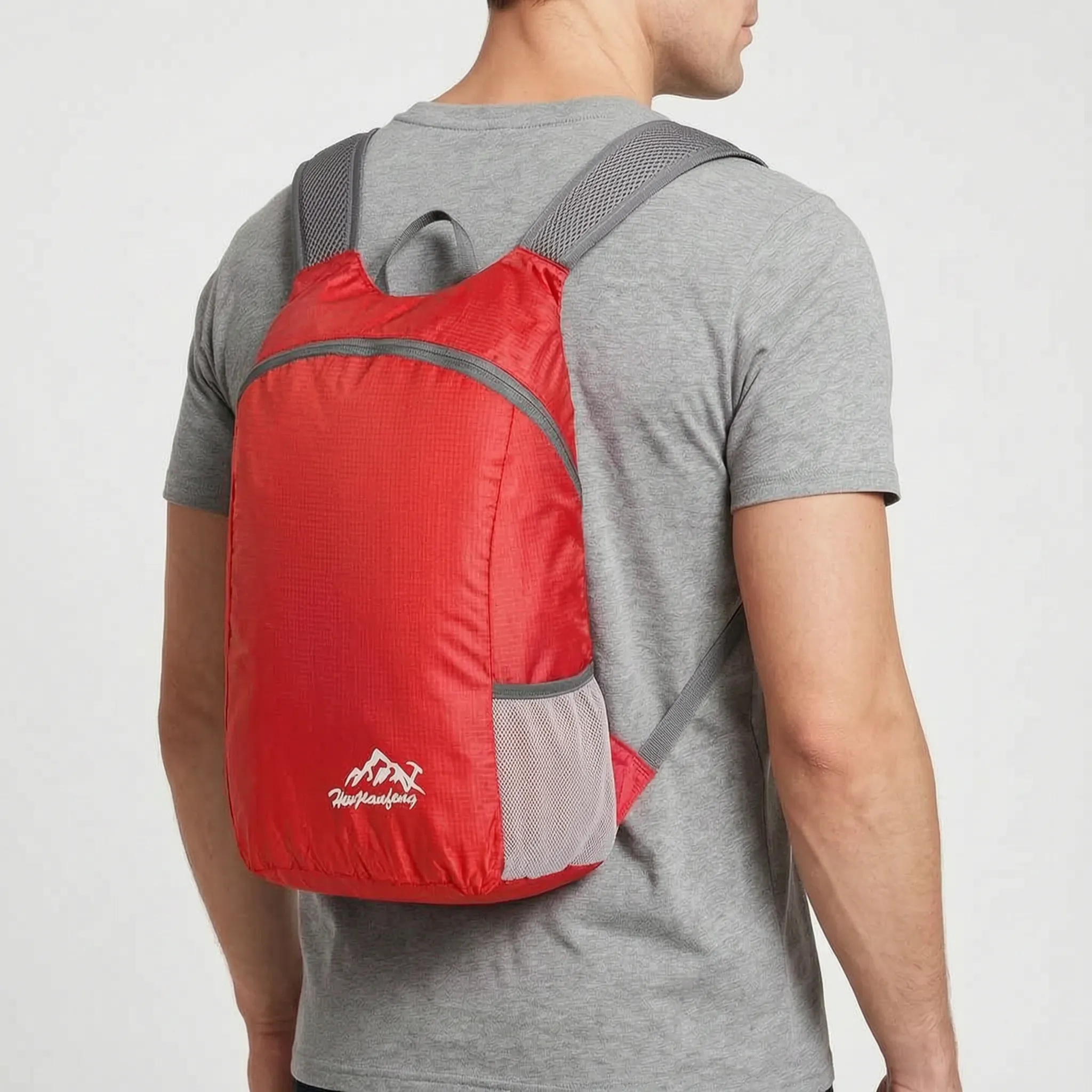 Foldable lightweight daypack with water-repellent outer shell and ventilated mesh straps
