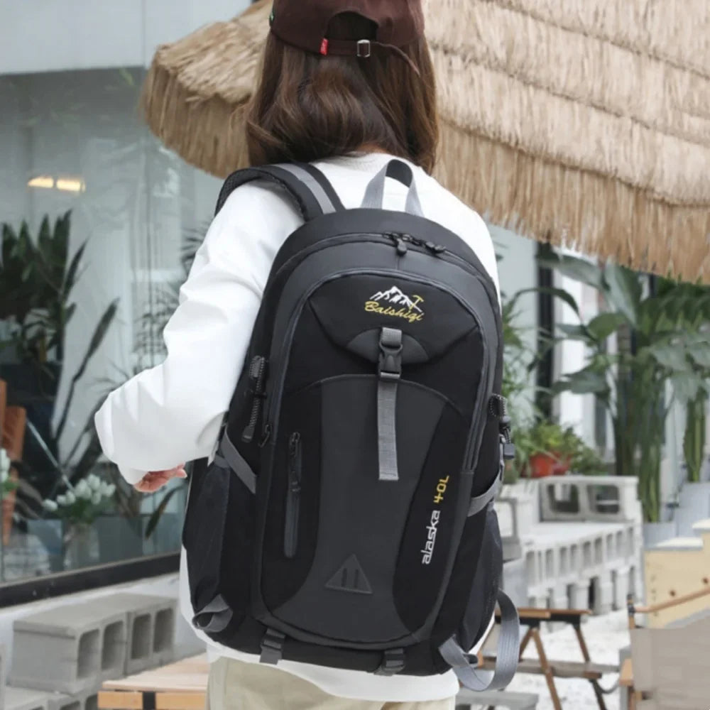 Multi-compartment hiking backpack with water-repellent nylon exterior