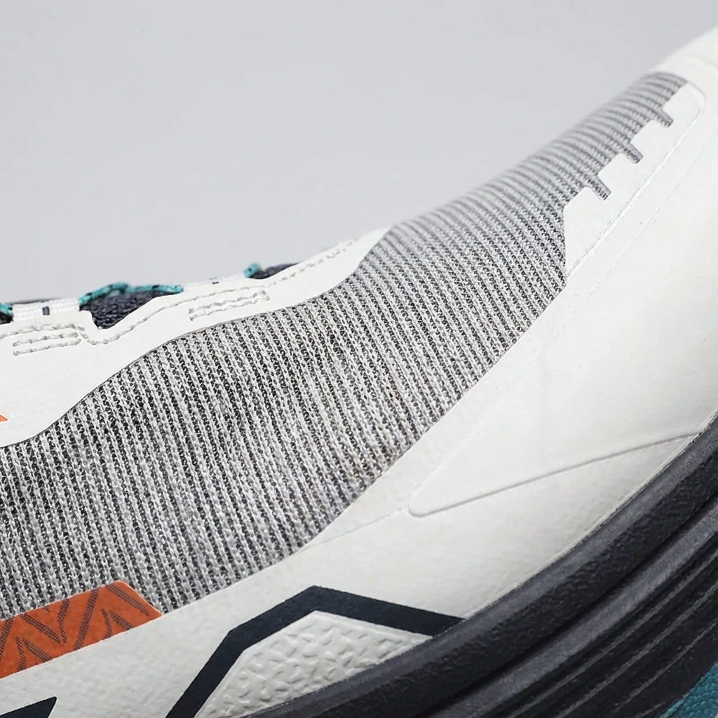 Low cut trail running shoe with breathable mesh and aggressive outsole