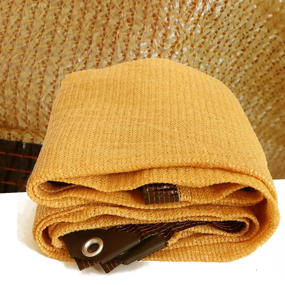 High coverage shade cloth with reinforced edges and metal eyelets for patio and garden use
