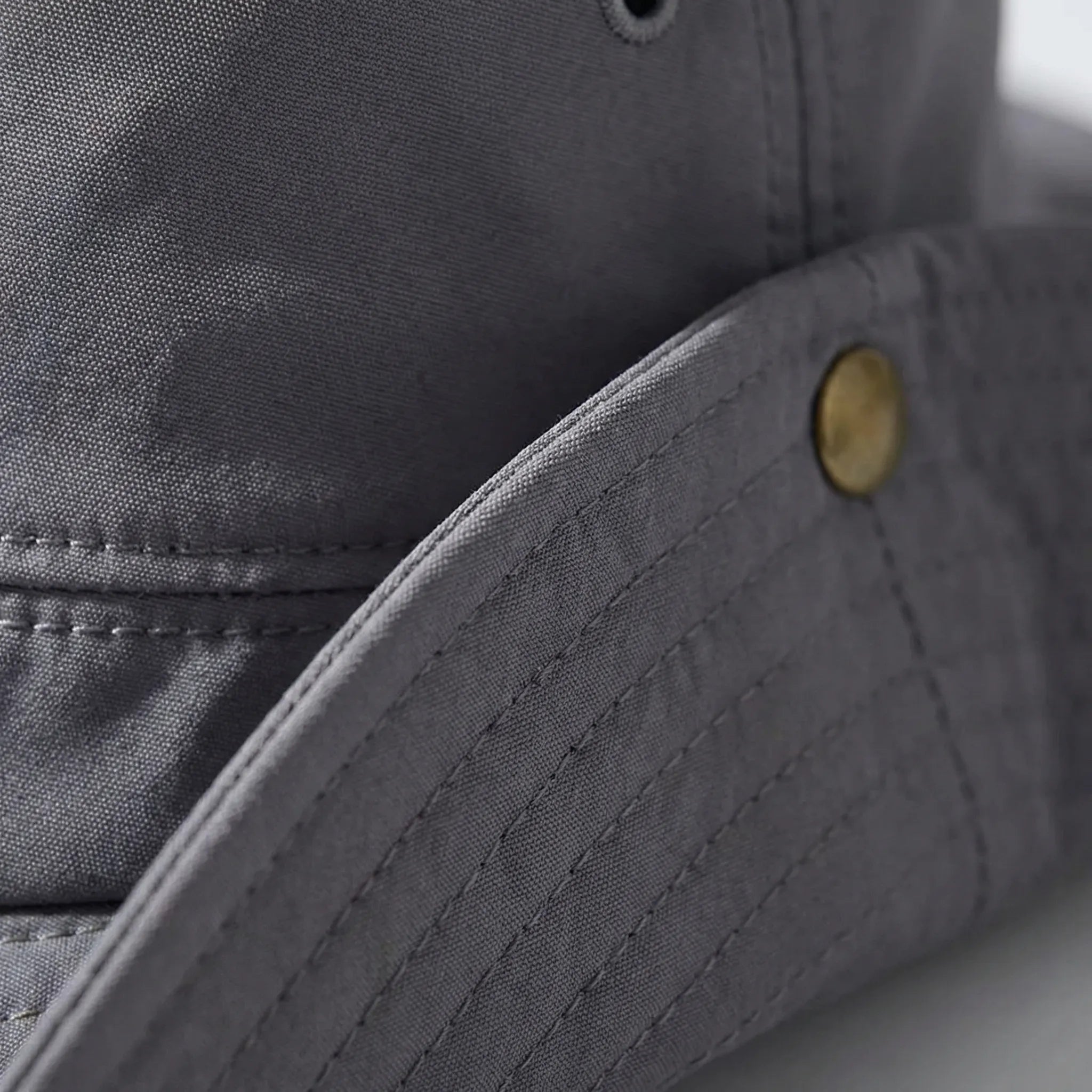 Wide-brim outdoor hat with waterproof quick-drying construction and adjustable chin cord