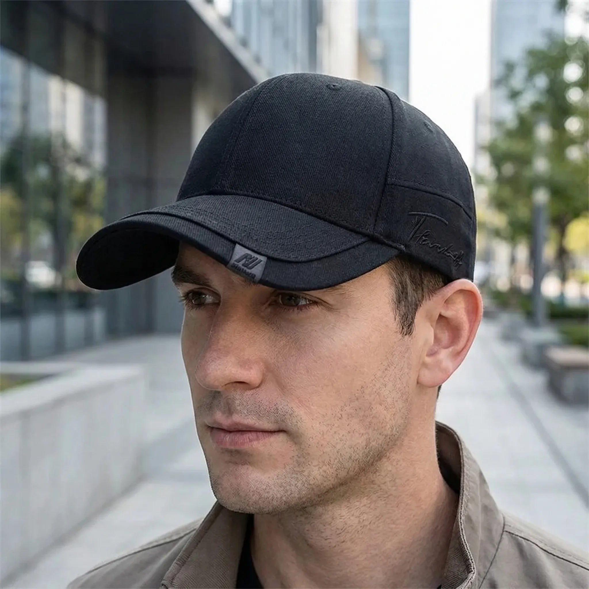 Minimalist baseball cap with curved peak and adjustable back strap