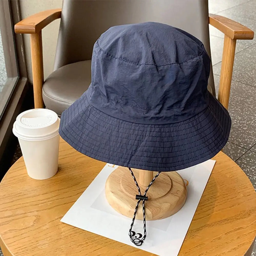 Wide-brim water-resistant fishing hat with UV protection for outdoor activities