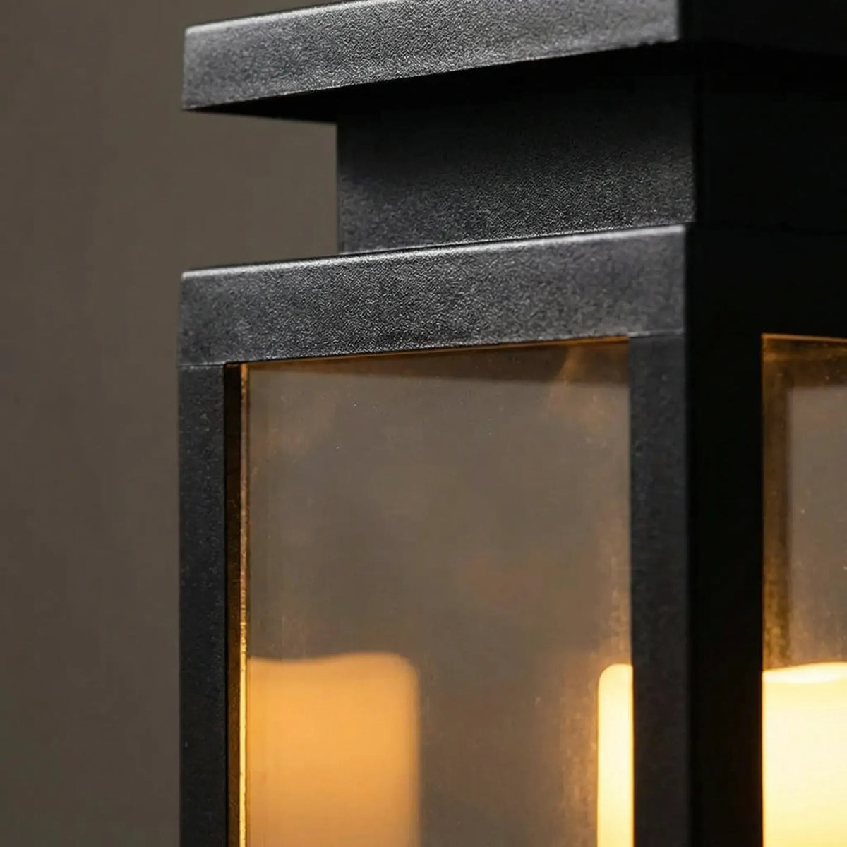 Solar-powered outdoor garden lantern with warm candle-effect glow