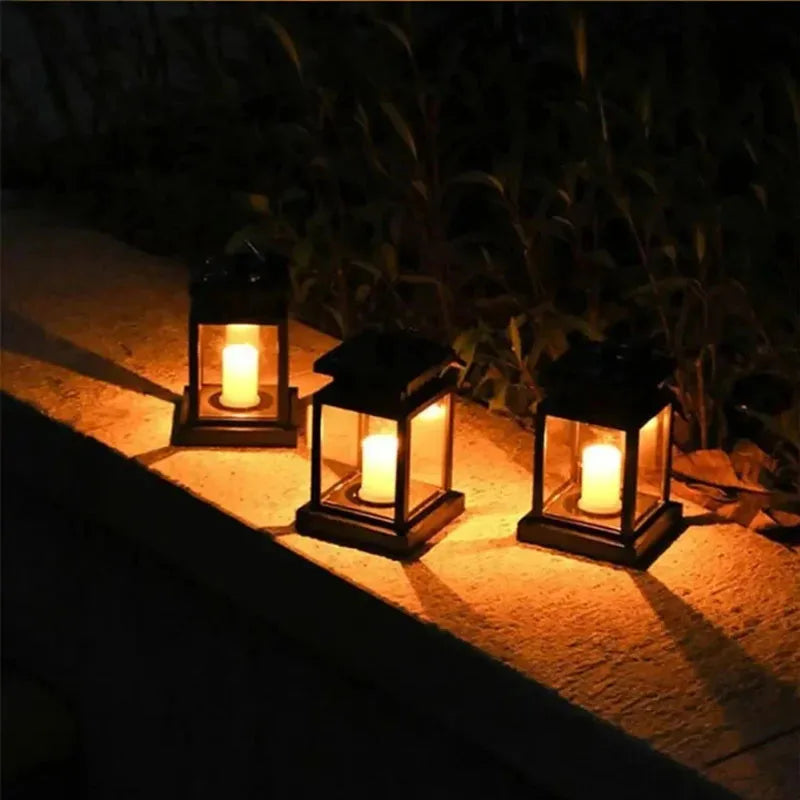 Solar-powered outdoor garden lantern with warm candle-effect glow