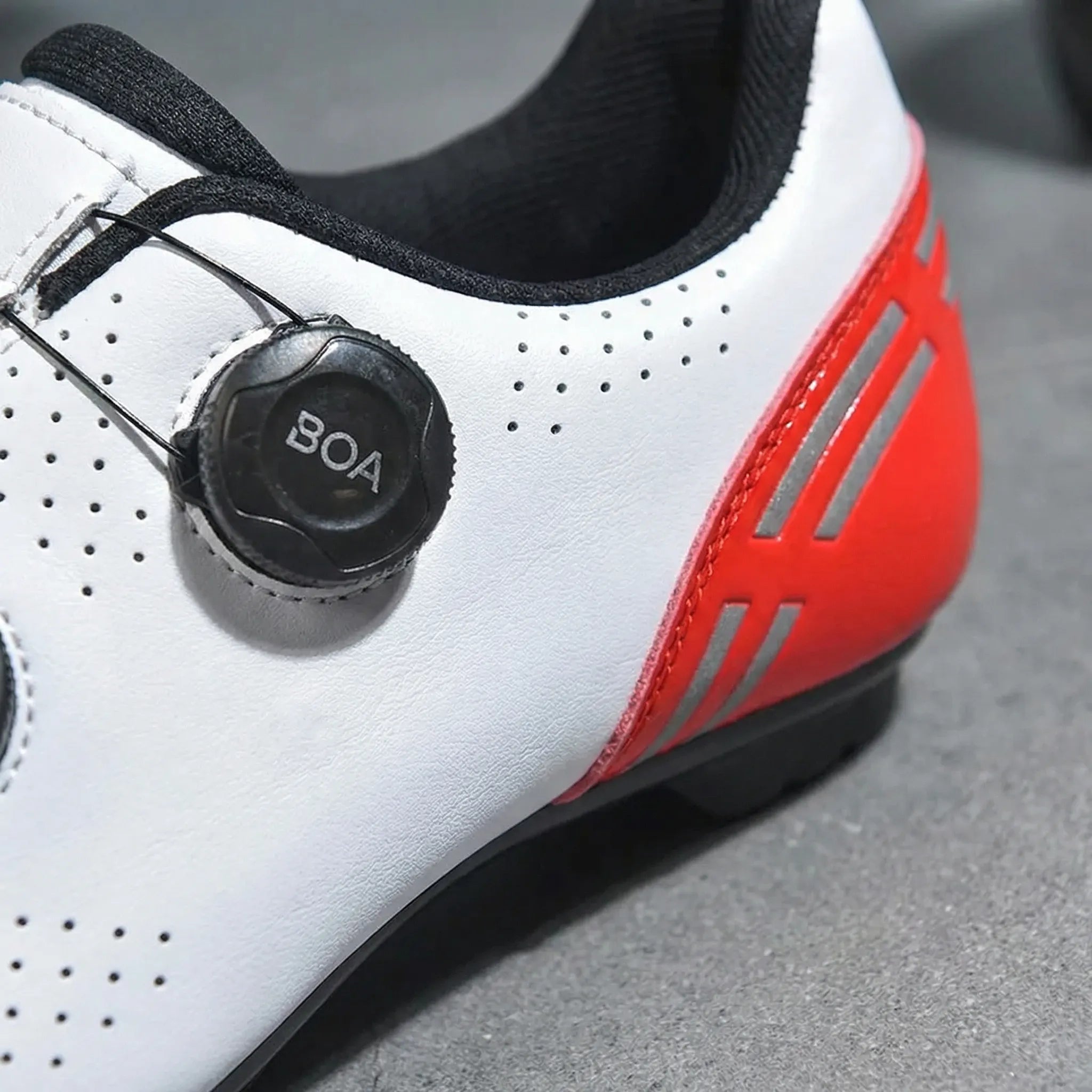 Dual-dial cycling shoe with perforated upper and non-slip sole for road and mountain biking