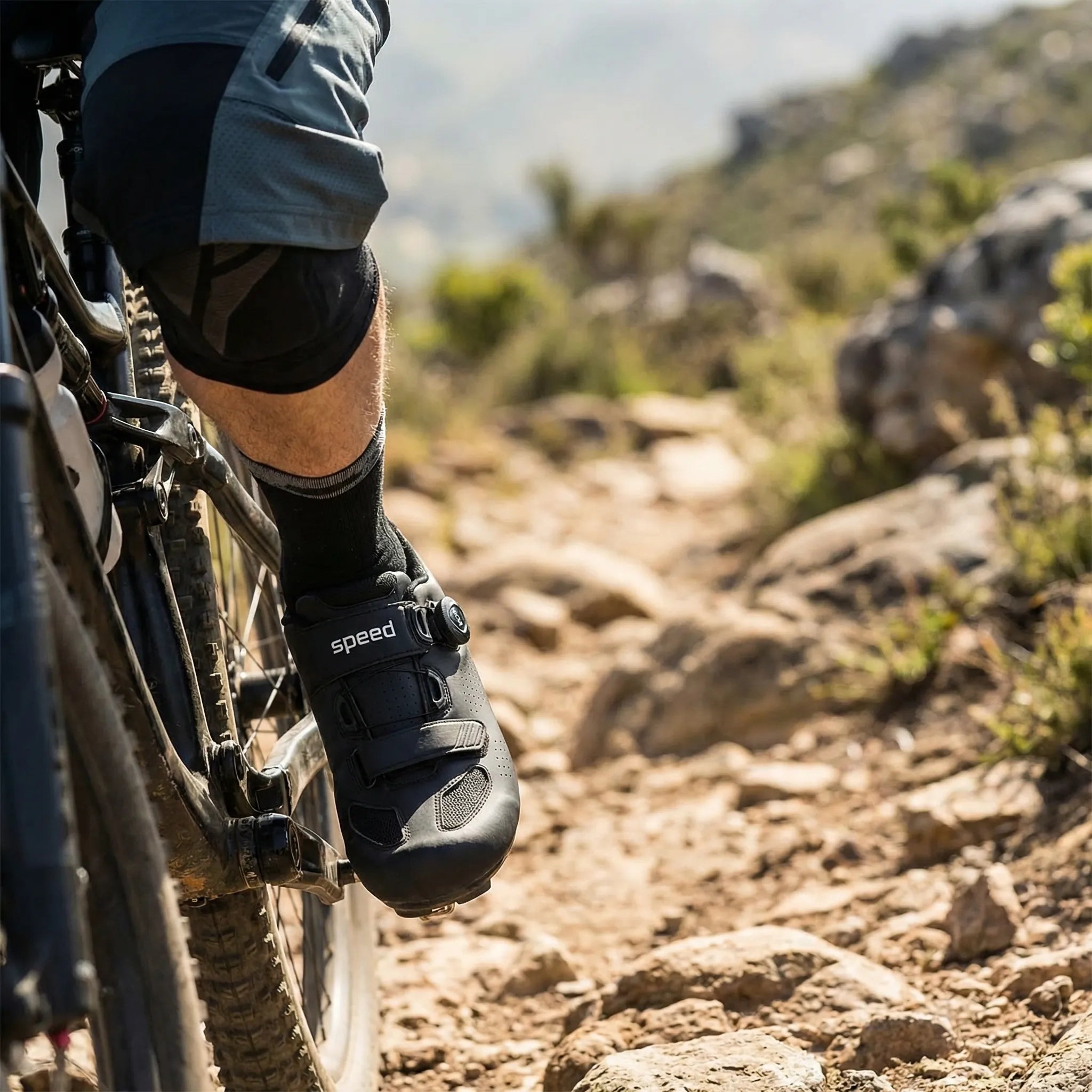 Mountain bike cycling shoe with self-locking cleat, rotary dial closure, breathable upper