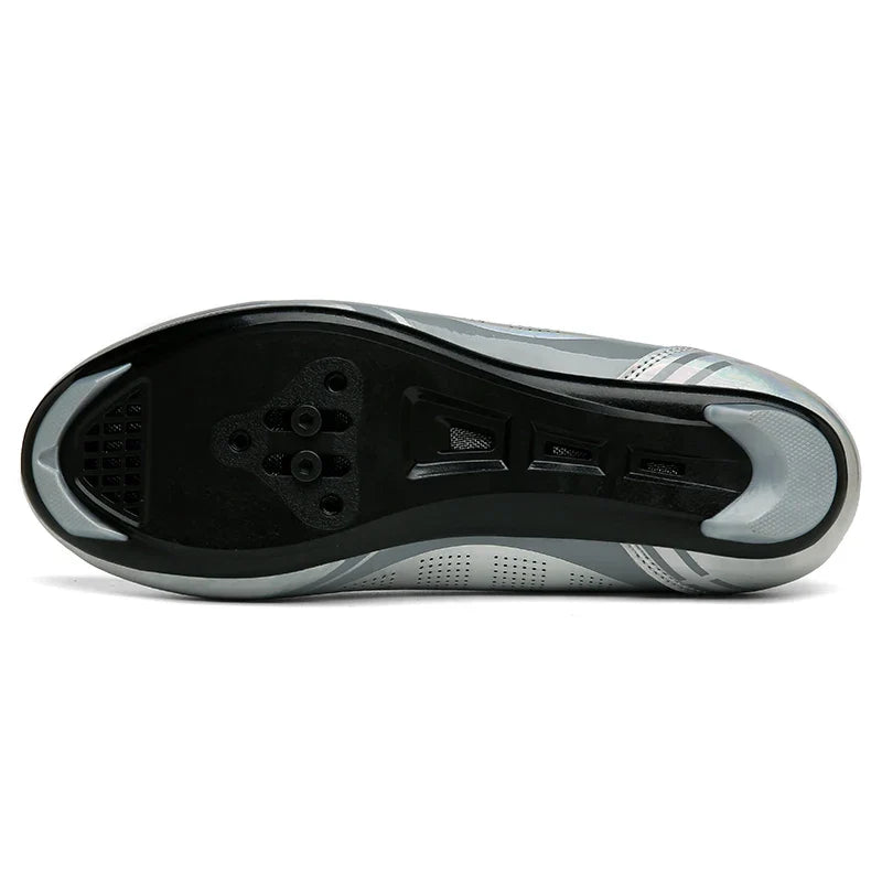 Road cycling shoe with dual rotary dial closure and self-locking cleat sole