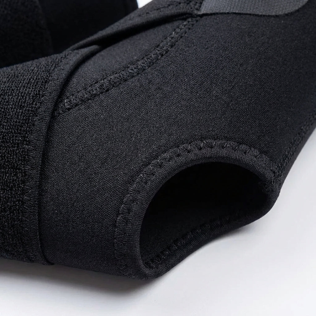 Adjustable ankle support sleeve with breathable construction and stabilizing straps