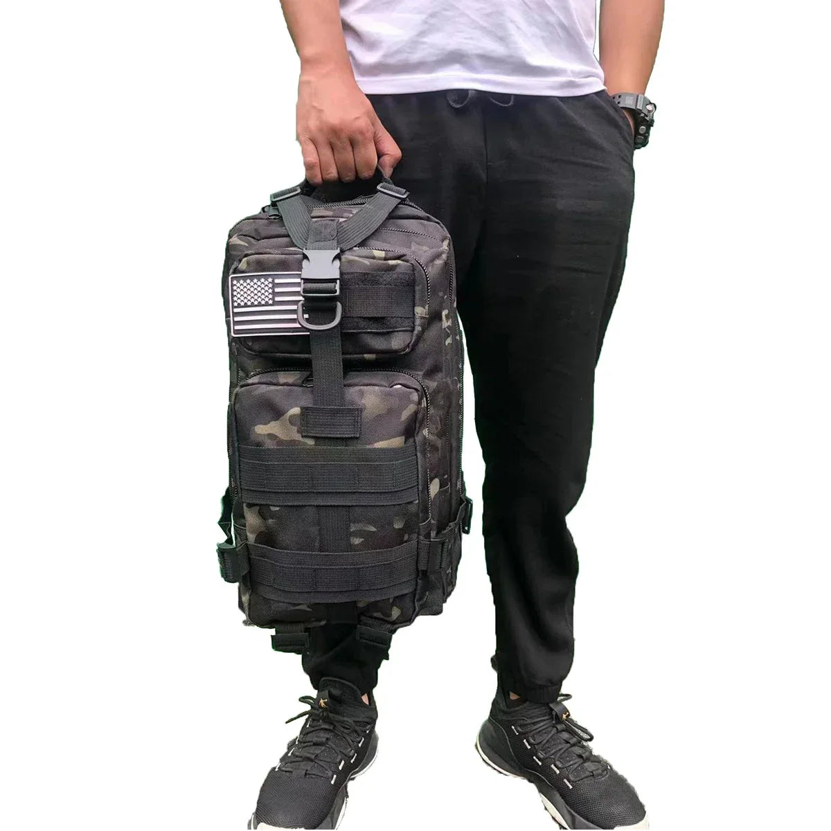 Tactical backpack with modular webbing and multiple compartments