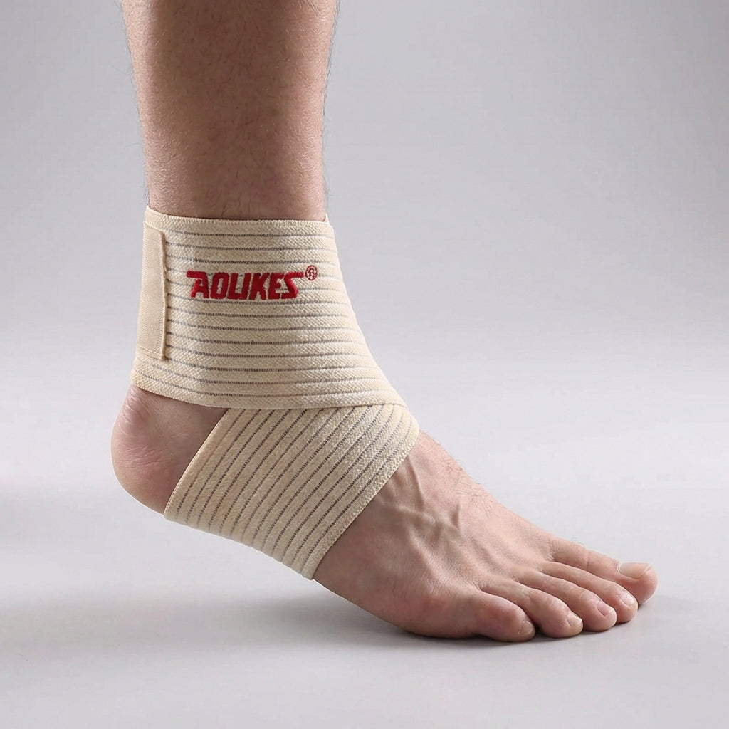 Adjustable ankle support wrap with targeted compression and breathable construction